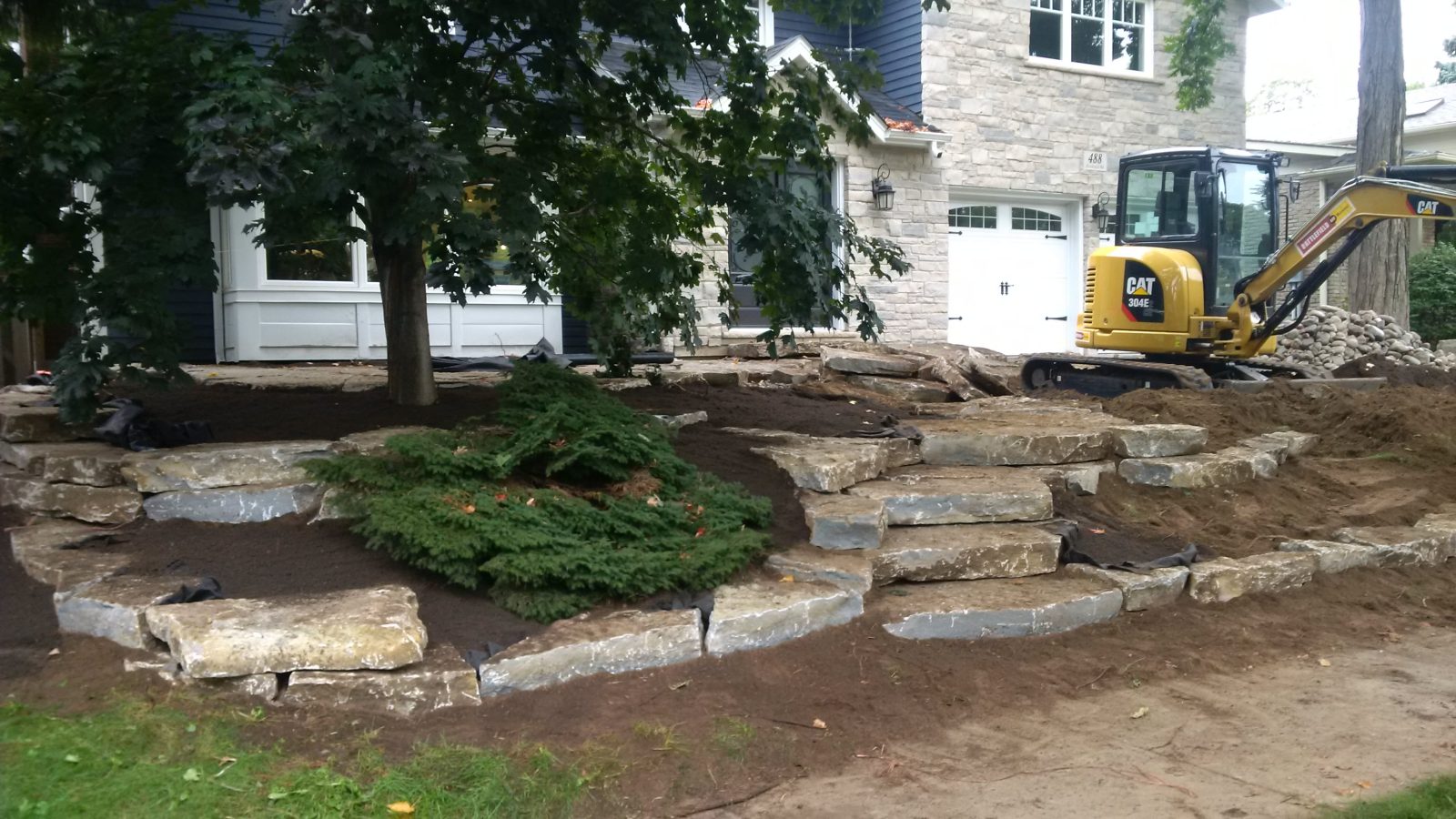Cat 304e Boulder Wall — Natural Stone Source Ontario