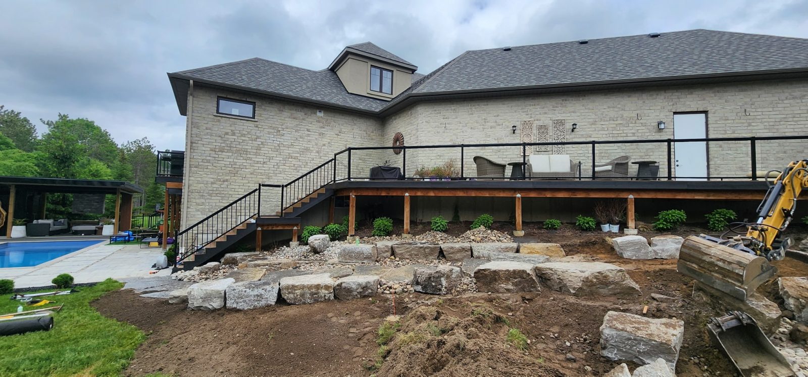 Excavator Wall Build — Natural Stone Source Ontario